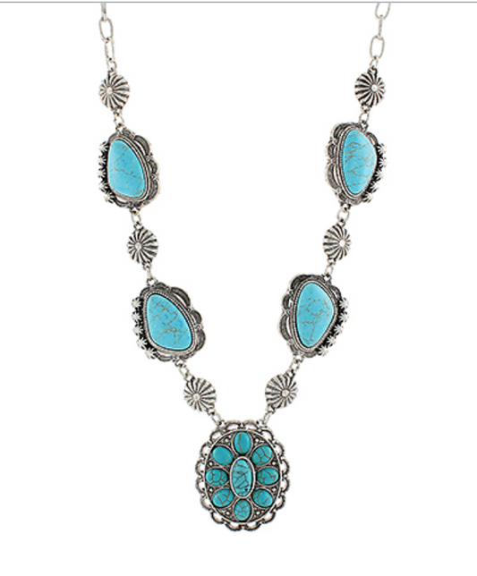 Bohemian Turquoise Statement Necklace with silver detailing and natural turquoise stones, designed for a chic and elegant look.
