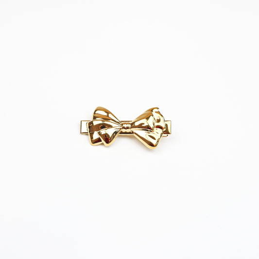 Elegant gold bow hair clip with a polished finish