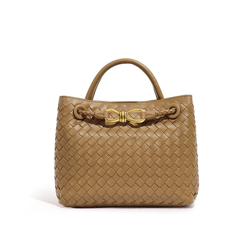 Elegant woven leather tote bag with gold-tone bow hardware and structured handles