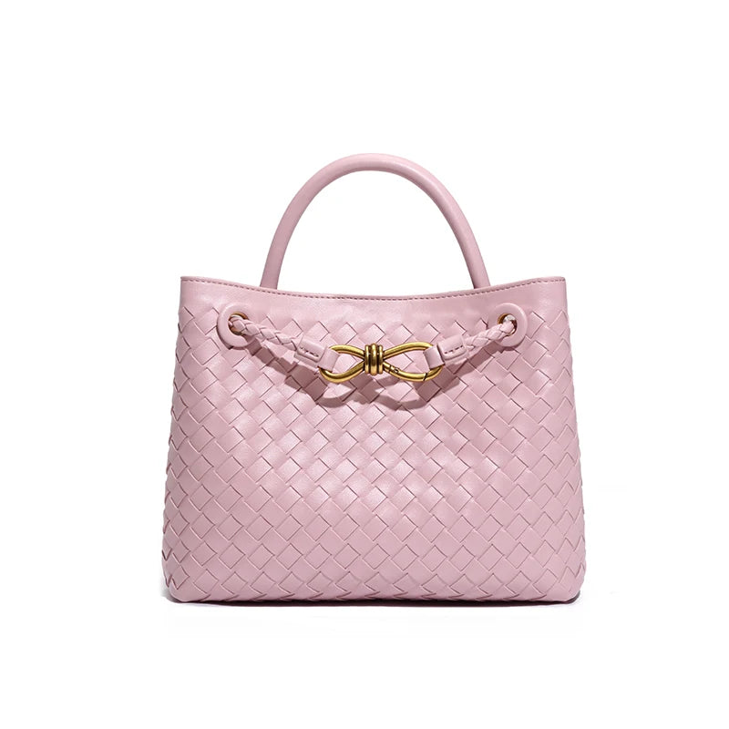 Elegant woven leather tote bag with gold-tone bow hardware and structured handles