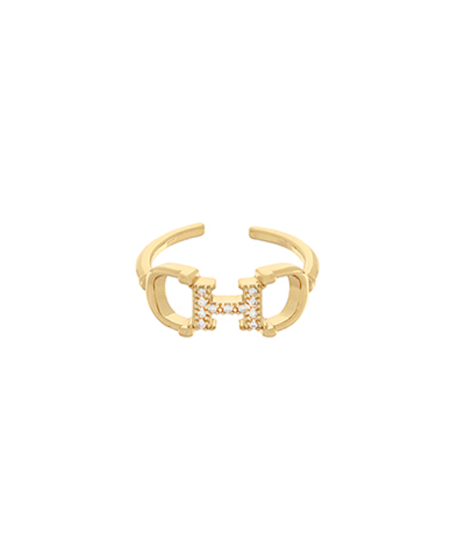 Elegant gold-plated ring with geometric design and white crystals, perfect for adding a modern touch to any outfit