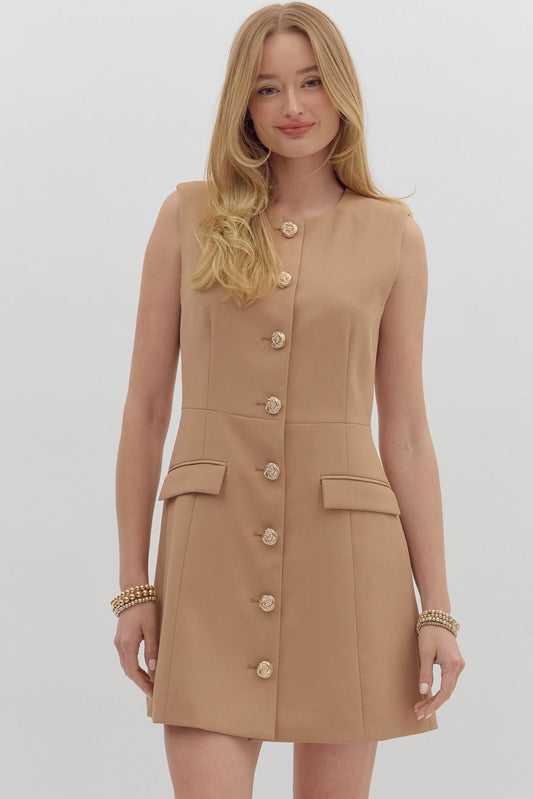 Chic sleeveless mini dress with gold buttons and flap pockets—your next game day essential.

