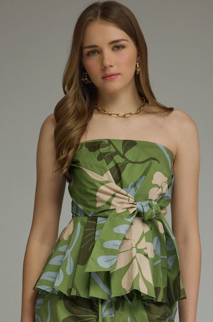 A romantic floral strapless peplum top with a flattering self-tie front and feminine silhouette for effortless warm-weather style.