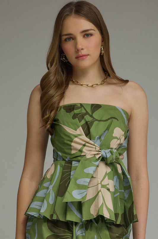 A romantic floral strapless peplum top with a flattering self-tie front and feminine silhouette for effortless warm-weather style.