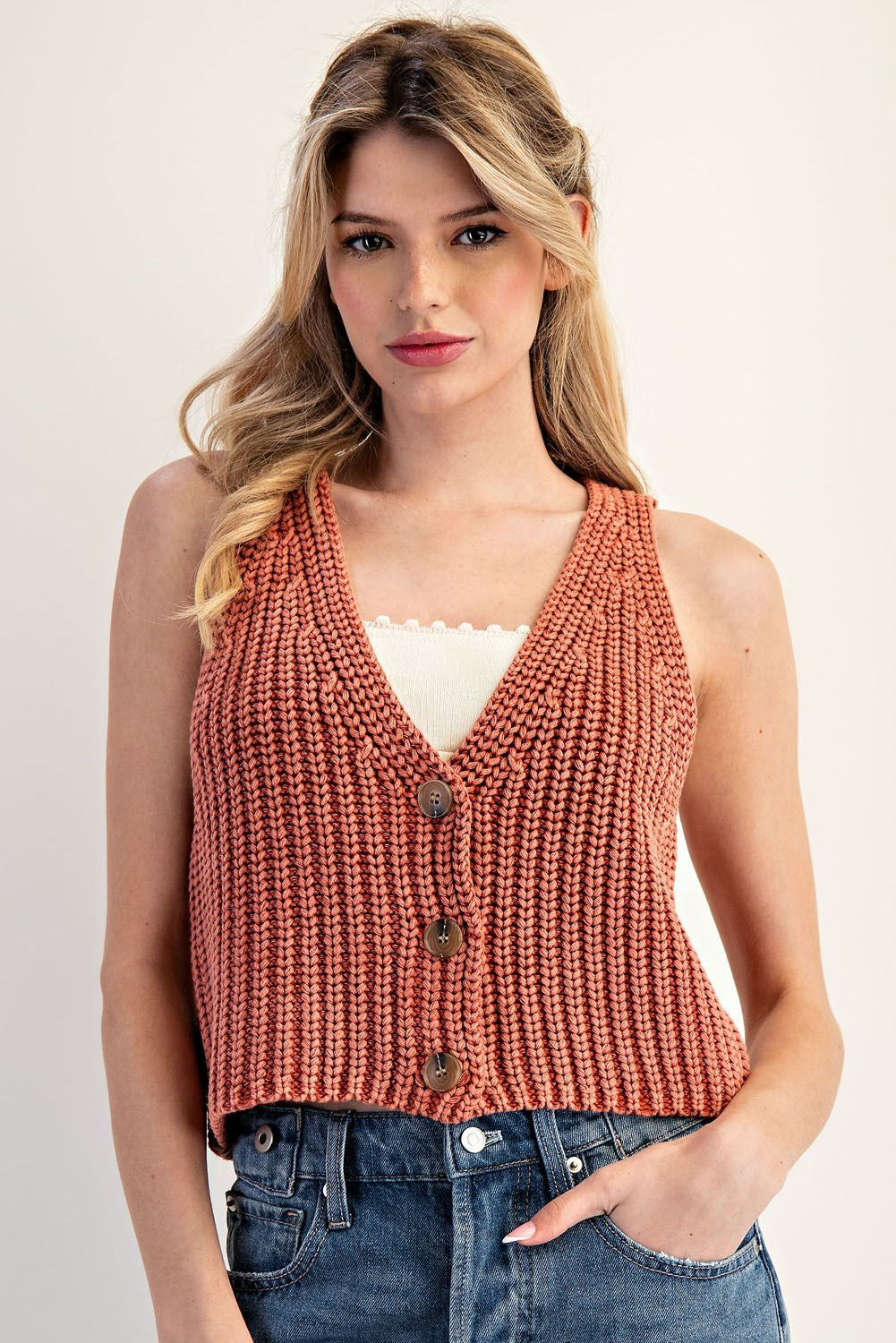 Cropped cotton knit vest with a deep V-neckline and button-down front.
