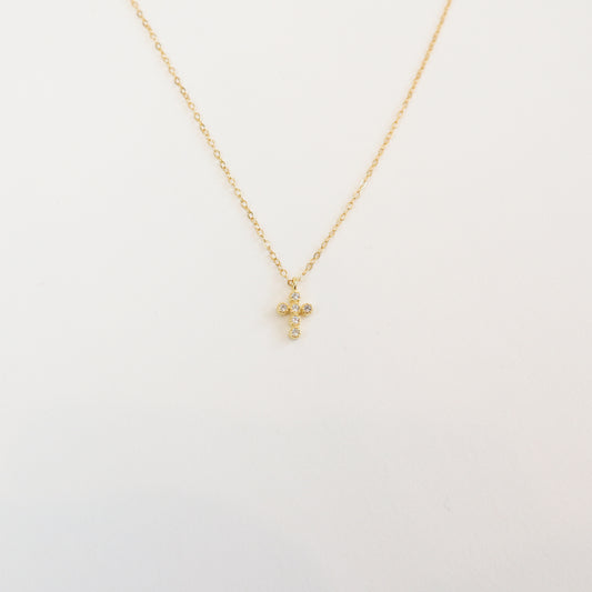 18K gold-plated 925 sterling silver dainty cross necklace with cubic zirconia accents on a delicate chain, perfect for everyday wear and faith-inspired jewelry.