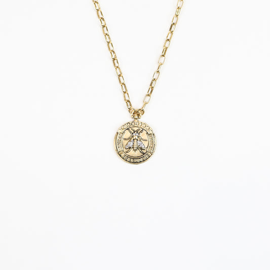 handcrafted 22K gold-plated bee medallion necklace featuring a detailed honeybee engraving with sparkling crystal accents, suspended from a chic gold link chain for a luxurious, nature-inspired look.