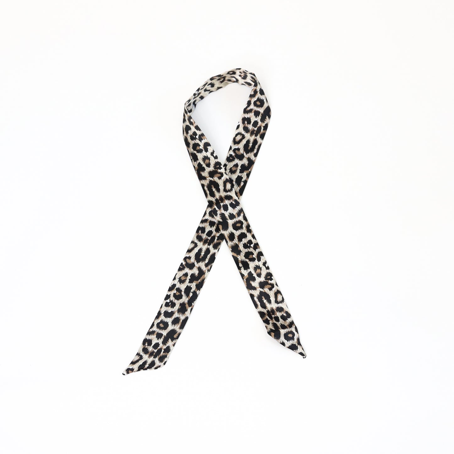 A twilly scarf with a bold dark cheetah print