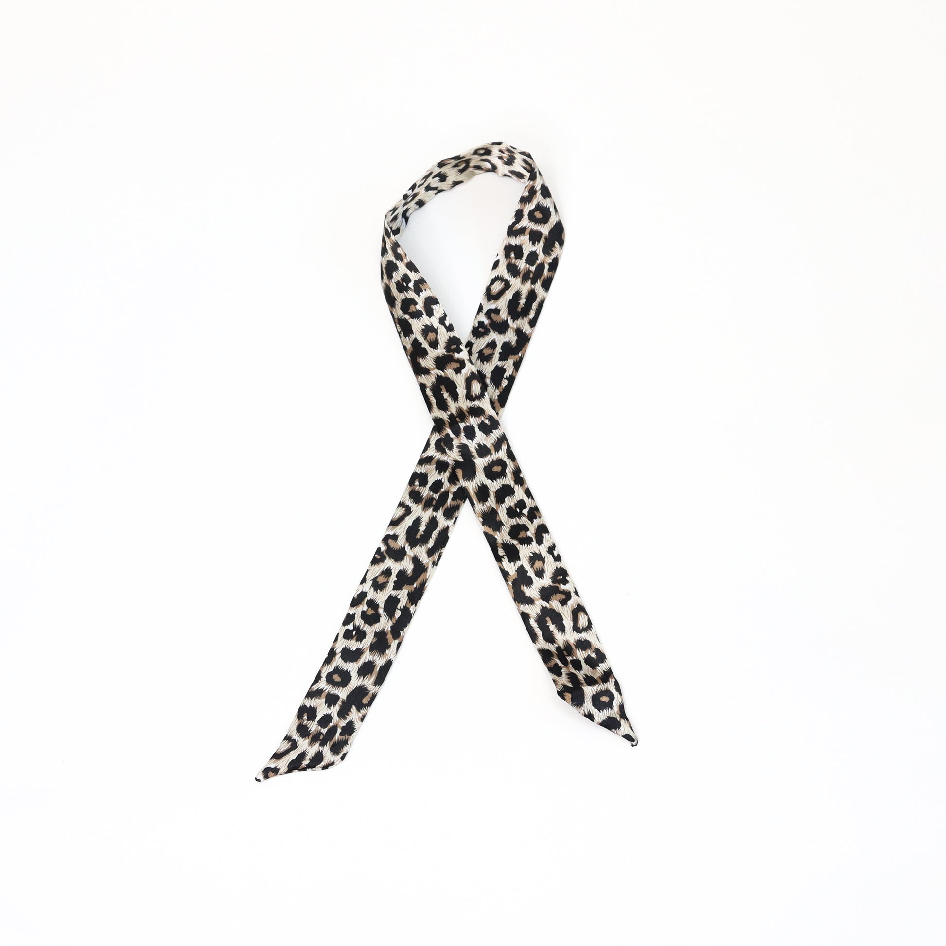A twilly scarf with a bold dark cheetah print