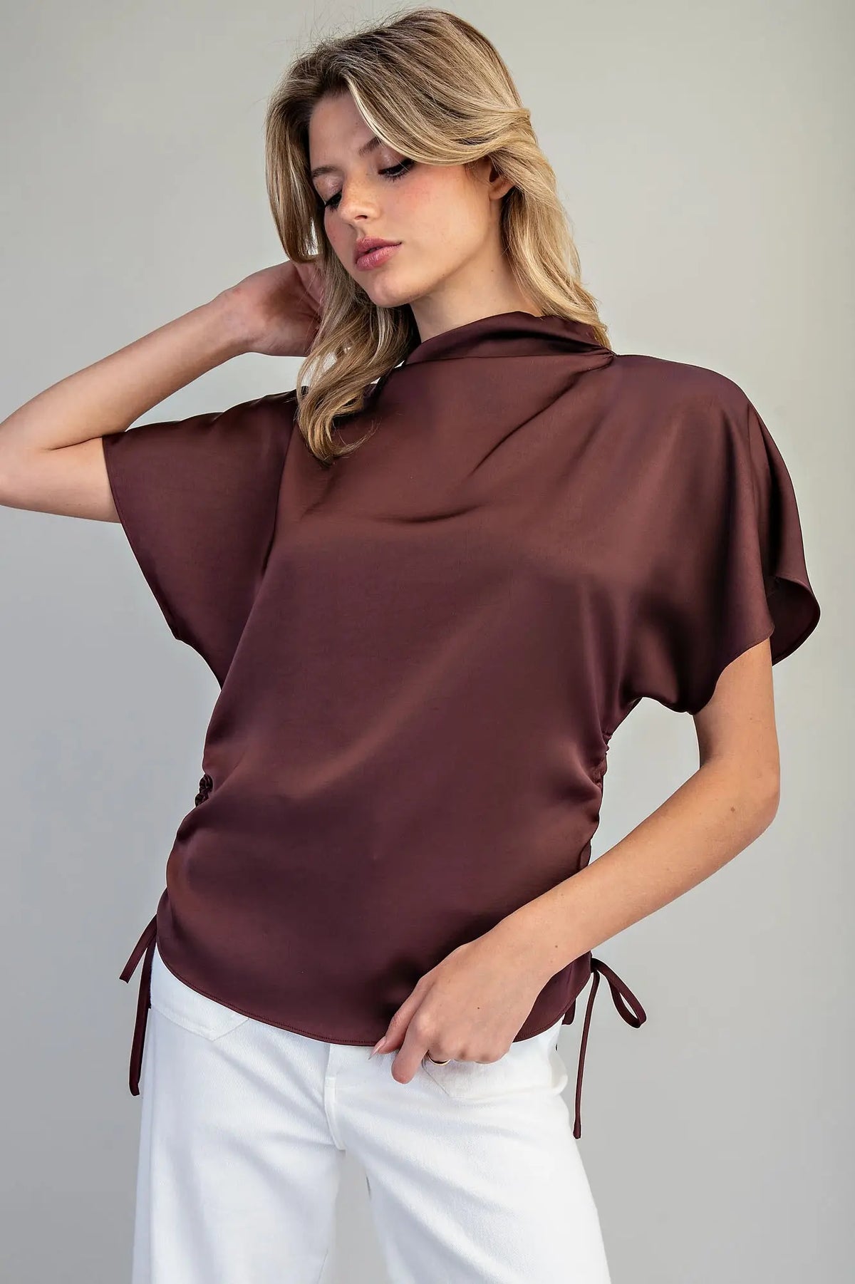Elegant satin top with adjustable side ties and relaxed fit in brown