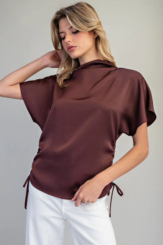 Elegant satin top with adjustable side ties and relaxed fit in brown