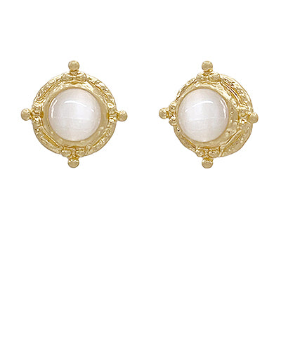 Gold stud earrings with polished white stones and textured beaded detailing, displayed on a white background.