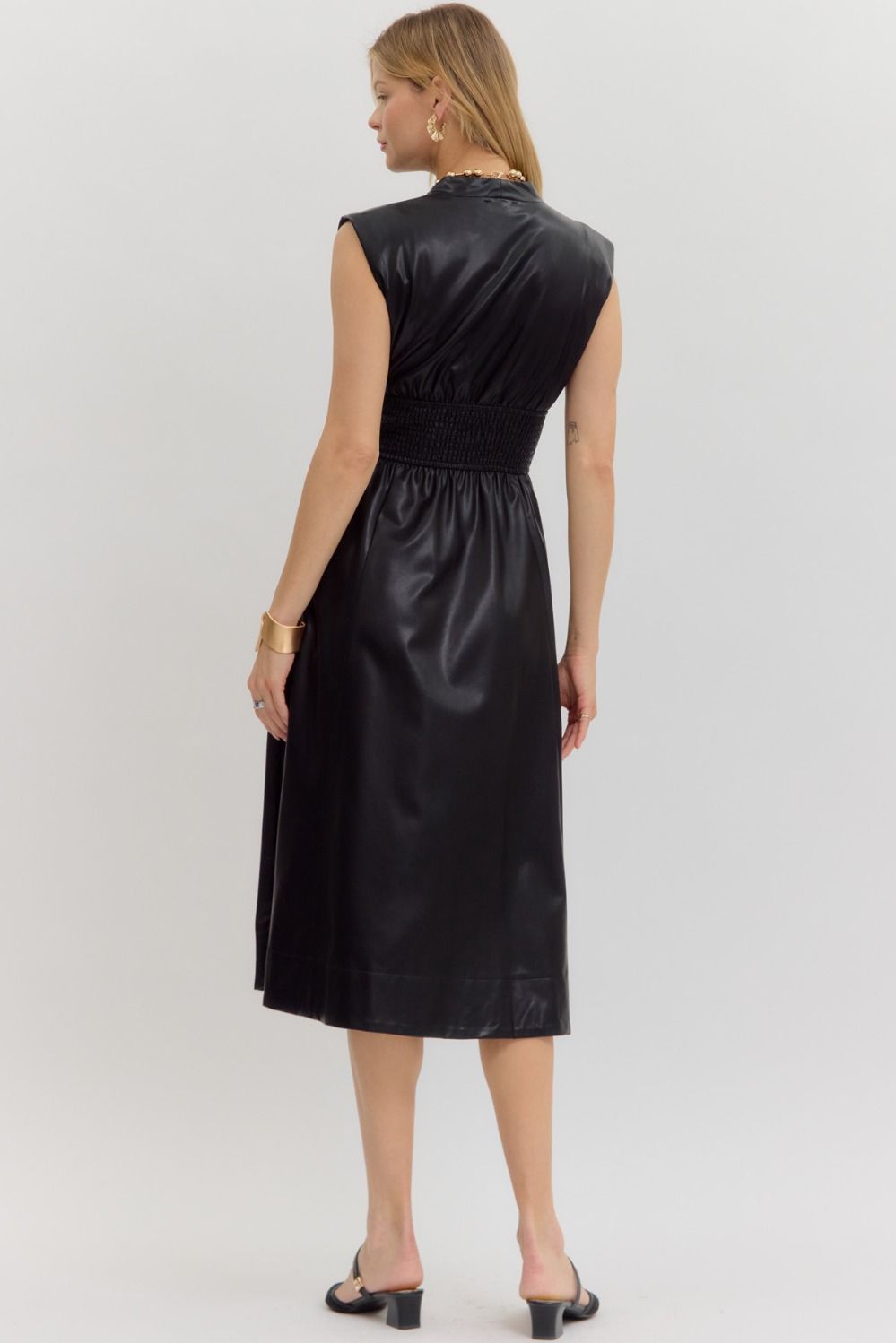 Edgy faux leather midi dress with smocked waist and front zipper—perfect for fall layering, concert outfits, or bold night-out looks.