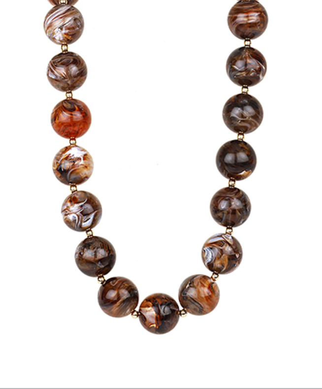Elegant marble bead necklace with gold accents, featuring a luxurious, timeless design.