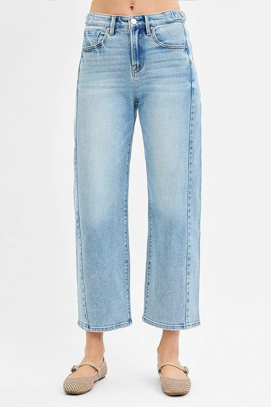 Front view of women’s barrel leg jeans in light blue wash.