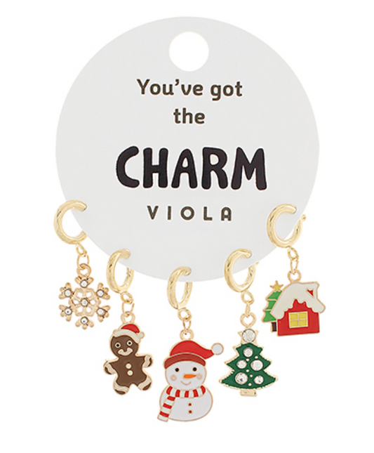 Five holiday-themed charms including a snowflake, gingerbread man, snowman, Christmas tree, and house, attached to gold-tone hoops, perfect for adding festive charm to any accessory.