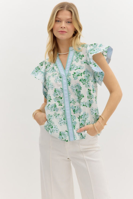 Floral print pullover top with contrast striped binding and tiered ruffle sleeves.

