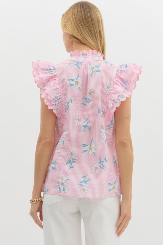 Floral striped pullover top featuring scallop embroidered edge ruffle over shoulder. Scallop edge ruffle band split collar. Unlined. Woven. Non-sheer. Lightweight.
