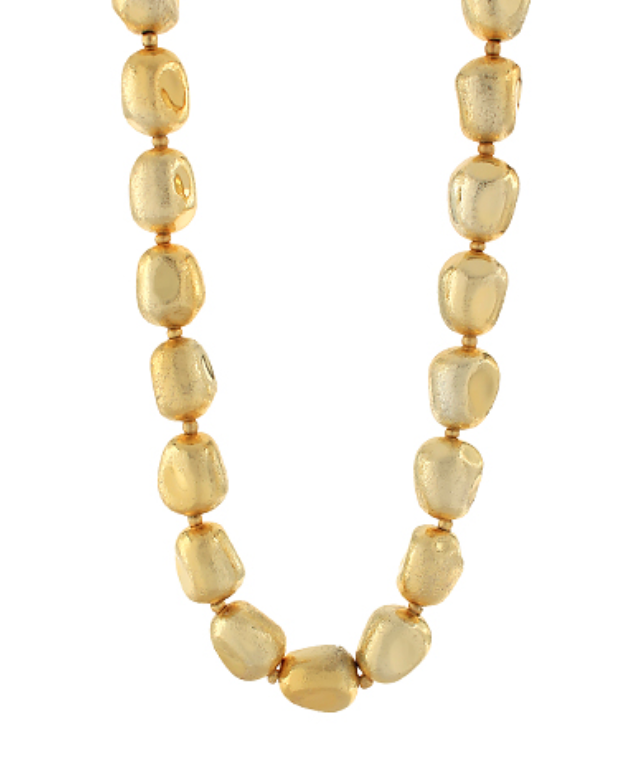  A close-up view of a necklace featuring a continuous string of numerous small to medium-sized, irregular, hammered or textured gold-toned beads. The beads are strung closely together, creating a full, voluminous look.