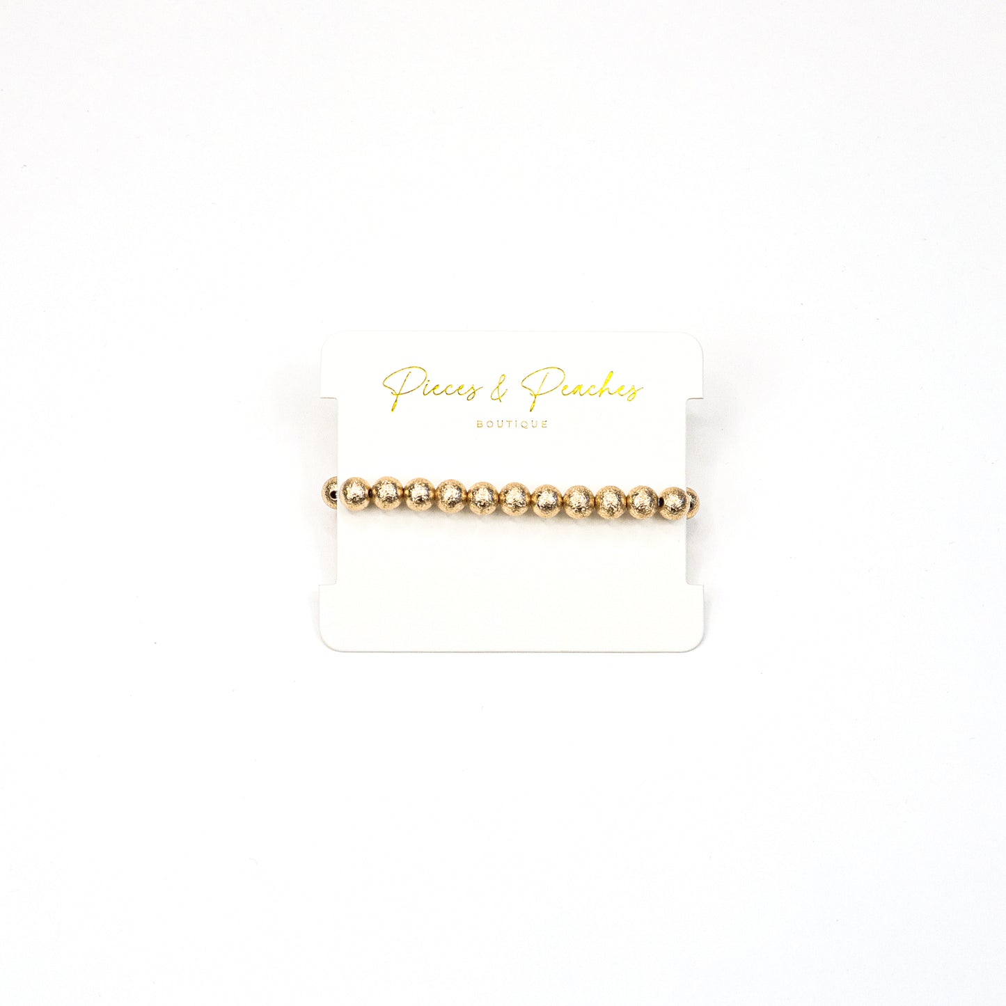 Gold statement earrings featuring an intricate textured design with a blend of brushed and polished finishes, offering a modern and elegant look
