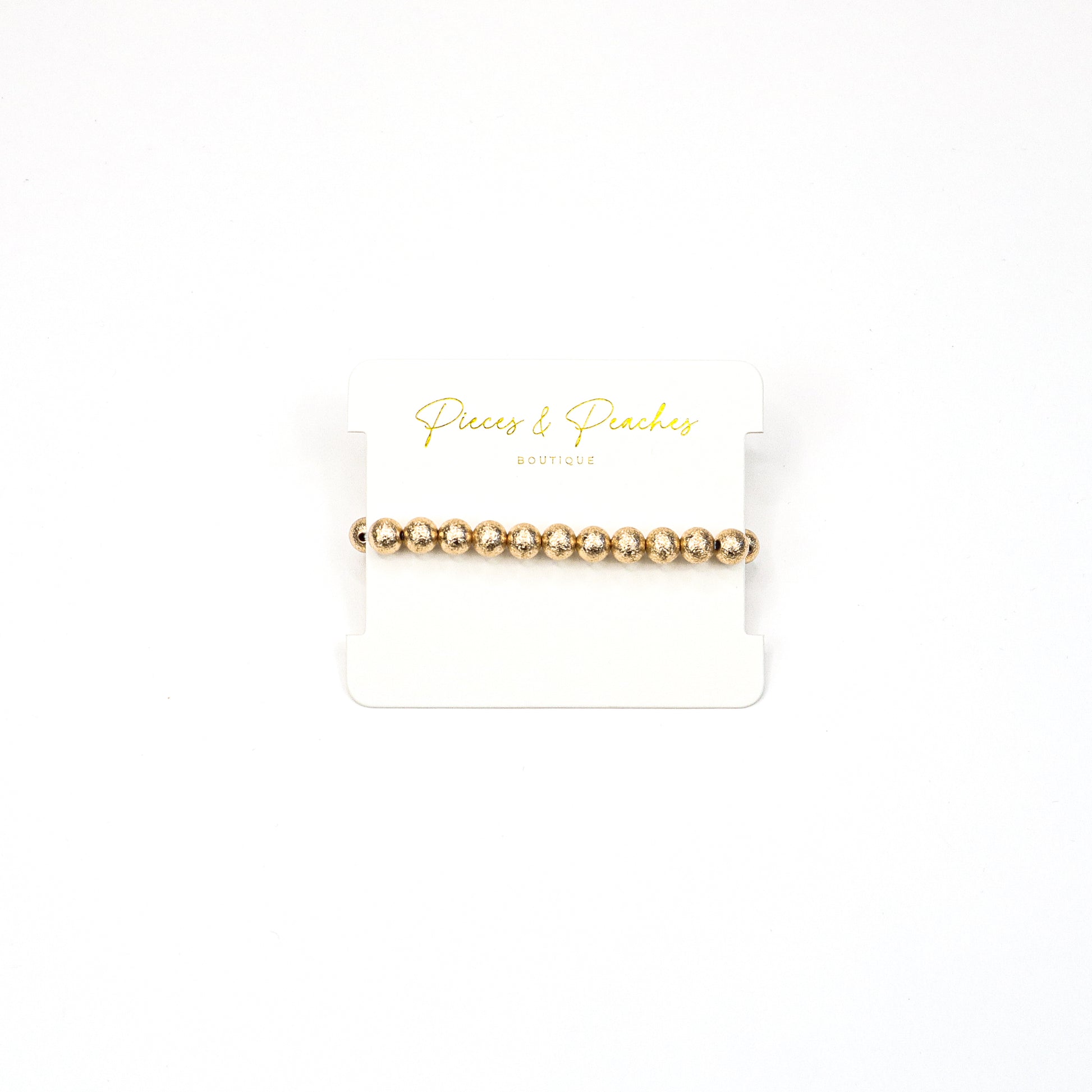 Gold statement earrings featuring an intricate textured design with a blend of brushed and polished finishes, offering a modern and elegant look