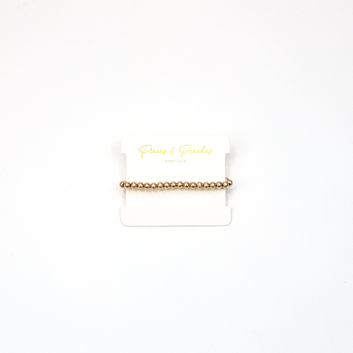 Gold statement earrings featuring an intricate textured design with a blend of brushed and polished finishes, offering a modern and elegant look