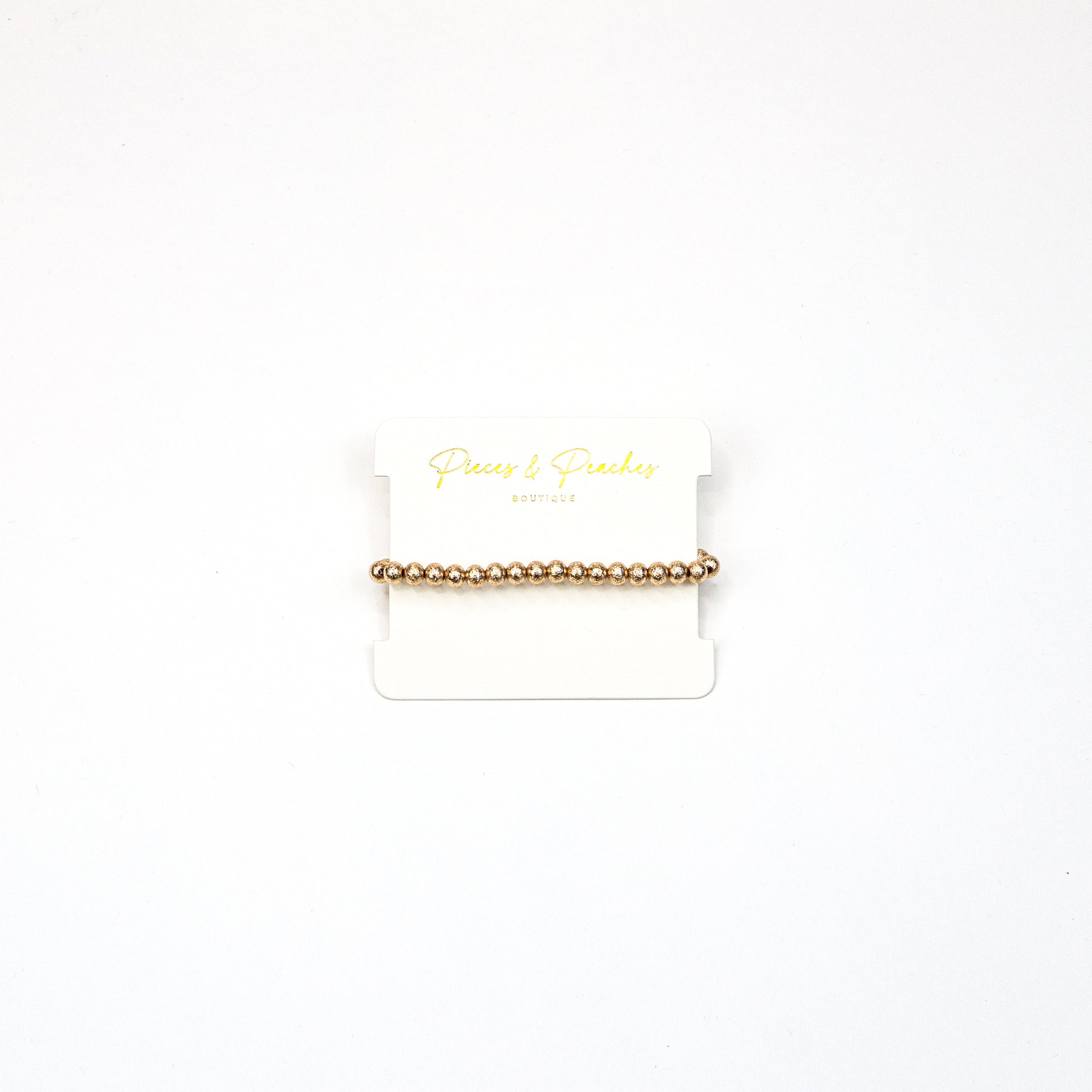 Gold statement earrings featuring an intricate textured design with a blend of brushed and polished finishes, offering a modern and elegant look