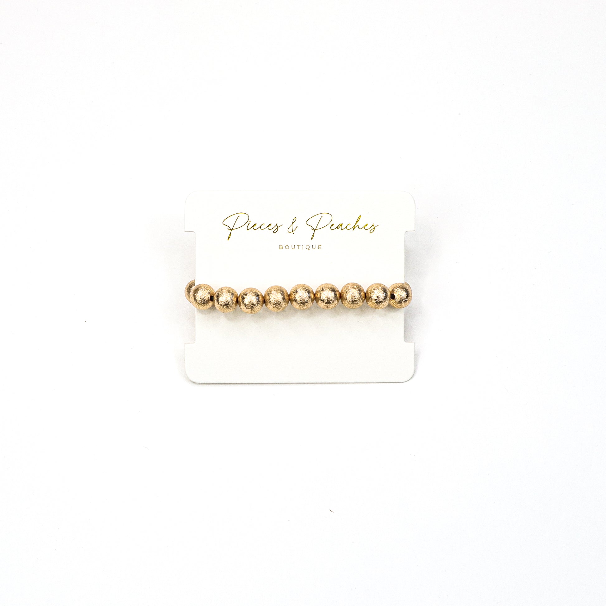 Gold statement earrings featuring an intricate textured design with a blend of brushed and polished finishes, offering a modern and elegant look