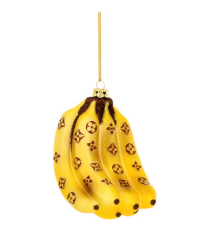 High Fashion Banana Bunch Ornament with Louis Vuitton-inspired monogram pattern, yellow bananas with brown detailing, hanging elegantly on a gold hook.