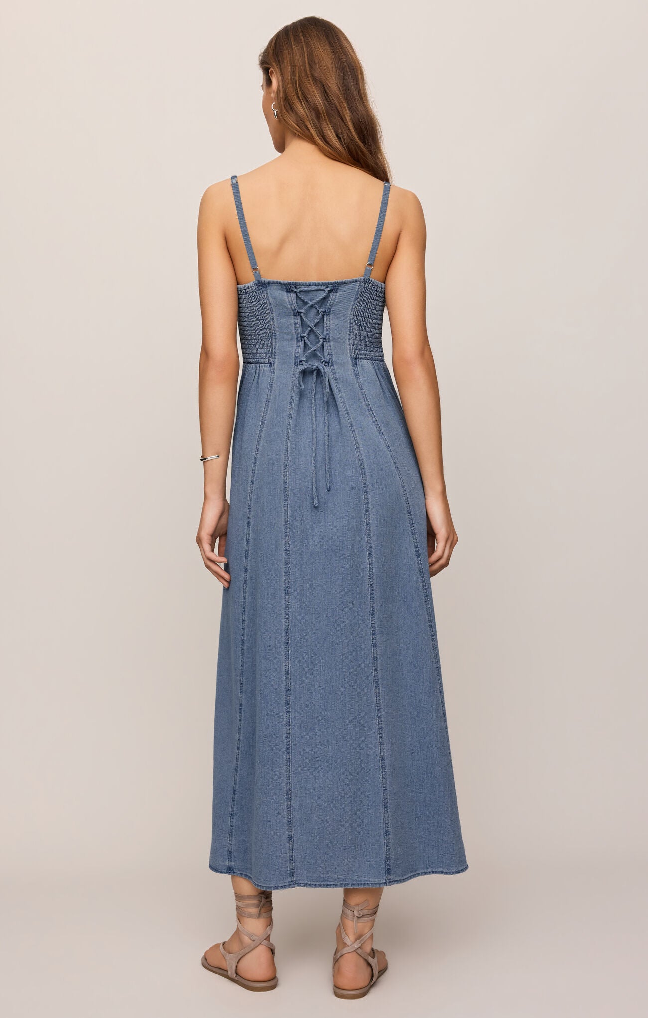 cotton indigo midi dress featuring a flattering square neckline, adjustable straps, light denim,
