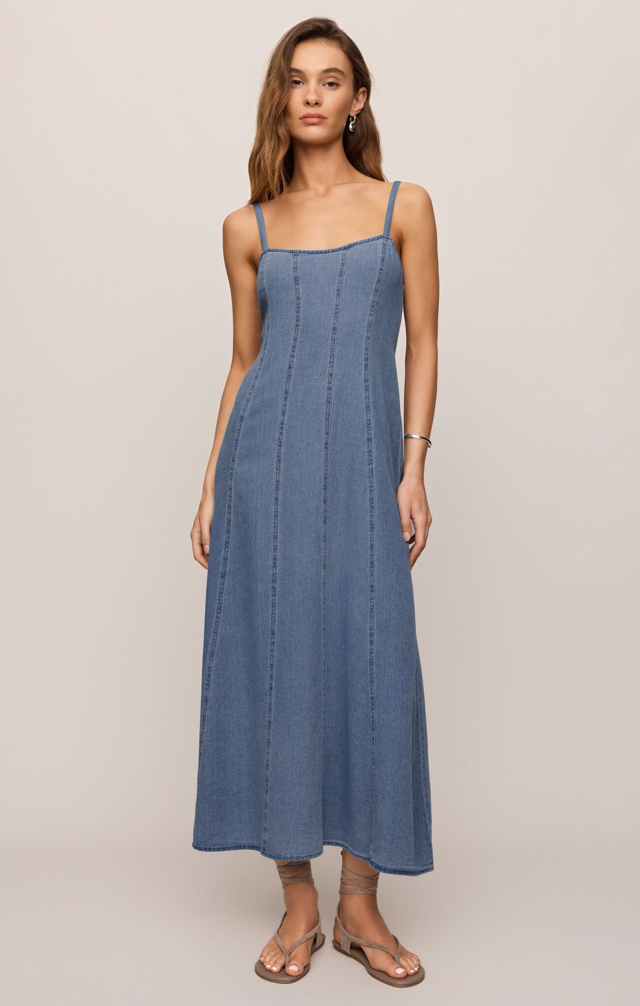 cotton indigo midi dress featuring a flattering square neckline, adjustable straps, light denim,

