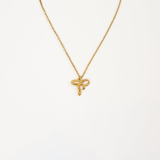 Intricate Bow Necklace with delicate gold bow pendant on a fine chain
