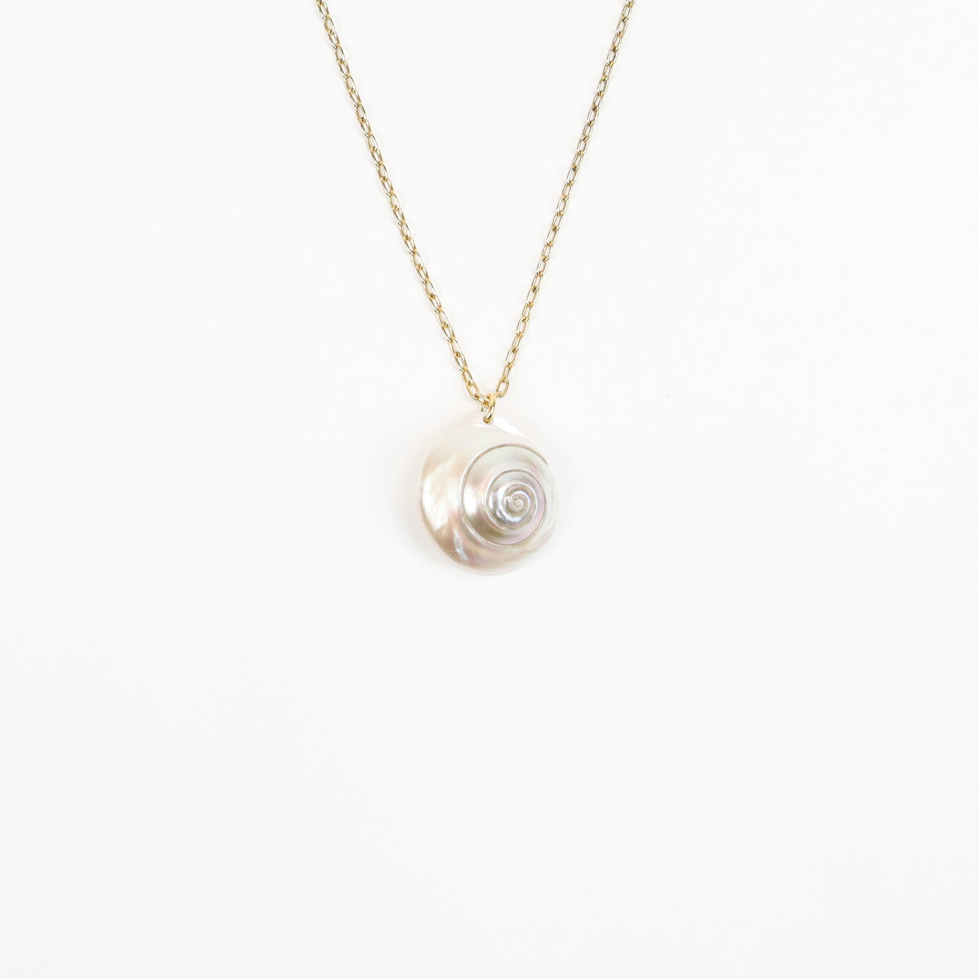 A handcrafted 22K gold-plated necklace featuring a genuine iridescent shell pendant, suspended on a delicate gold chain, radiating soft pearlescent hues for a natural, coastal-inspired look.