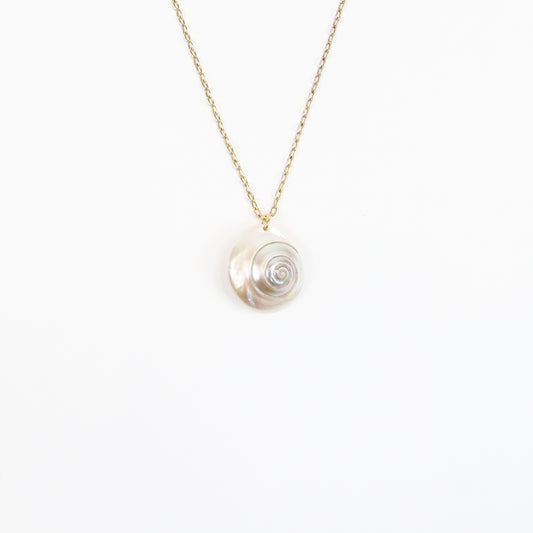 A handcrafted 22K gold-plated necklace featuring a genuine iridescent shell pendant, suspended on a delicate gold chain, radiating soft pearlescent hues for a natural, coastal-inspired look.