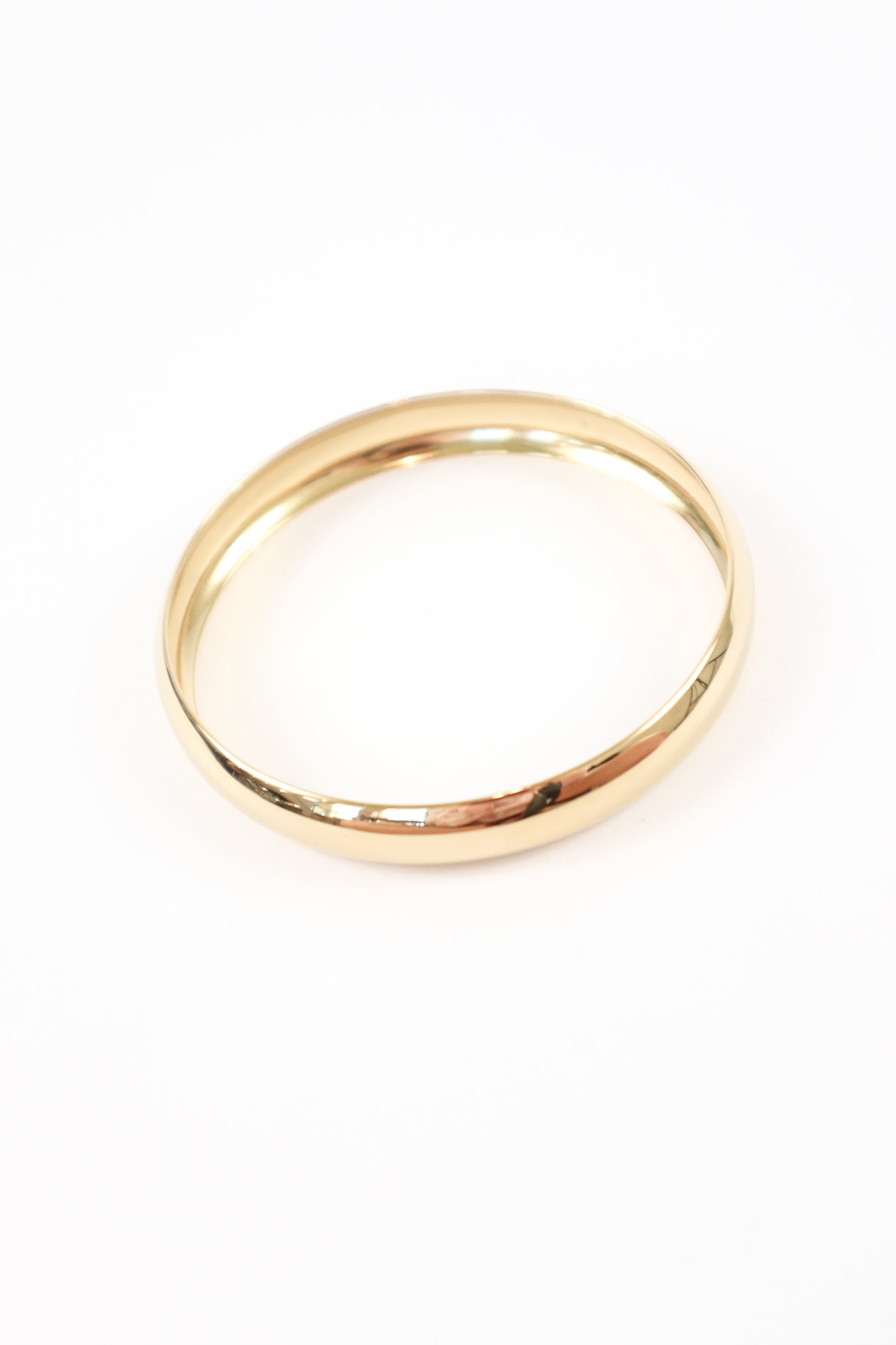 Classic slim gold bracelet with smooth rounded finish