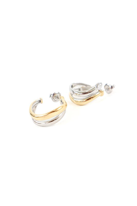 Mixed metal hoop earrings featuring twisted gold and silver layered design with post back closure