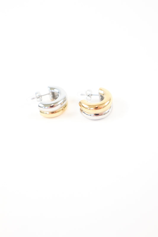 Two-tone chunky dome huggie earrings in polished gold and silver with post back closure