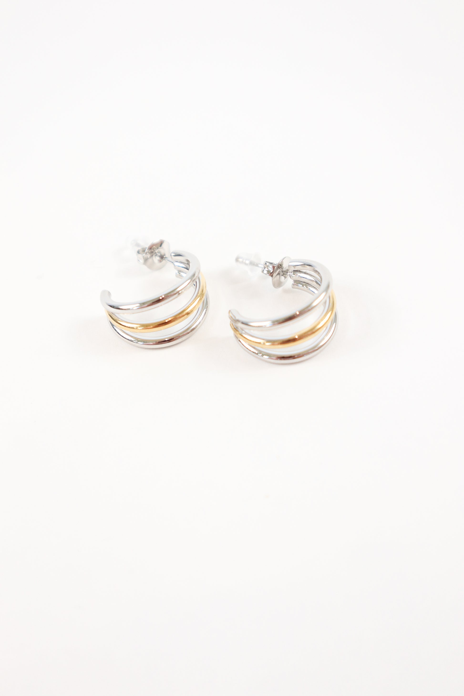 Modern mixed metal half hoop earrings with stud backing