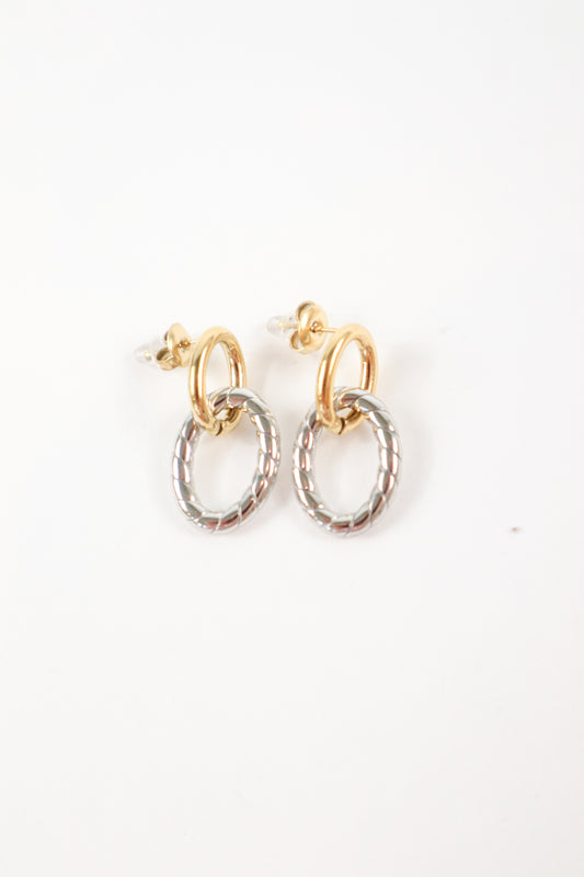 Two-tone gold and silver twist drop earrings with textured oval charm and polished gold hoop