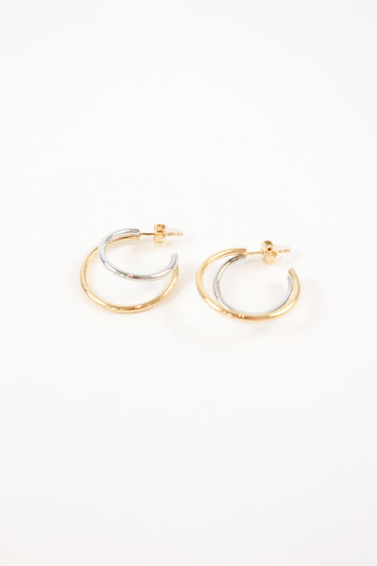 Two-tone gold and silver double hoop earrings with polished finish and post back closure