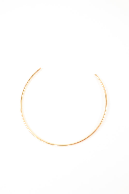 Minimalist gold open collar necklace with sleek high-polish finish