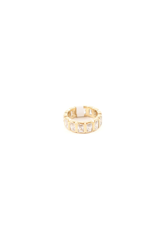 Bold gold eternity band with radiant-cut cubic zirconia stones set in a structured rectangular gold frame, polished high-shine finish