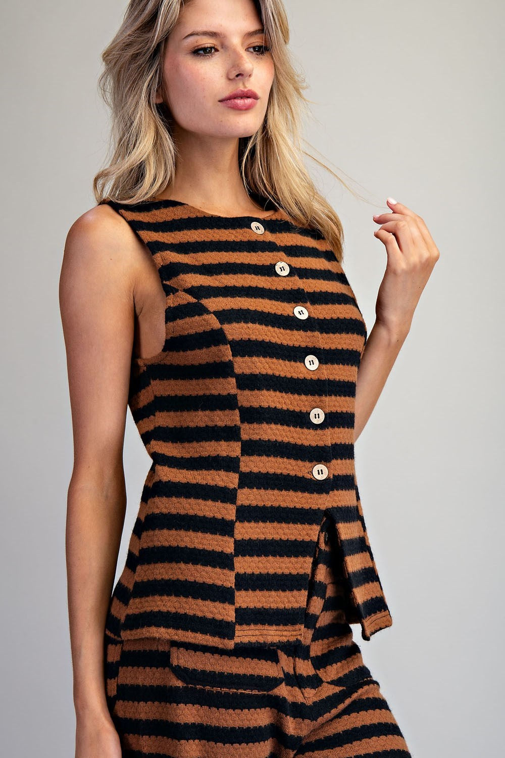 The Isolde Scallop Striped Knit Vest combines playful stripes with timeless layering style.