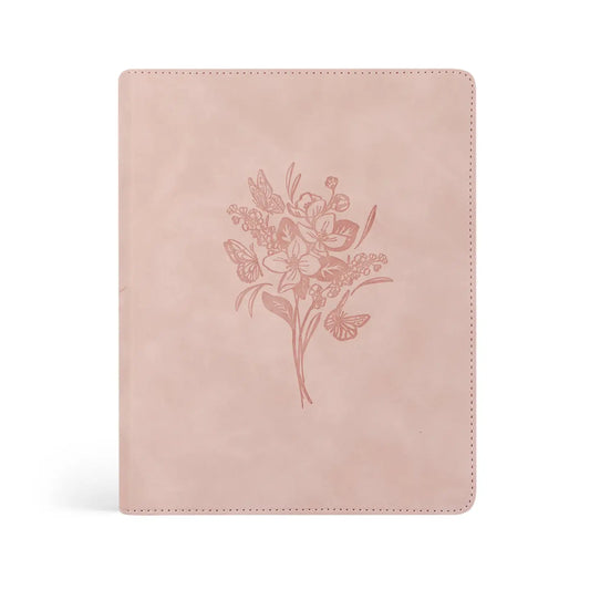 Shiloh Journaling Bible with blush pink vegan leather cover and embossed floral and butterfly design.