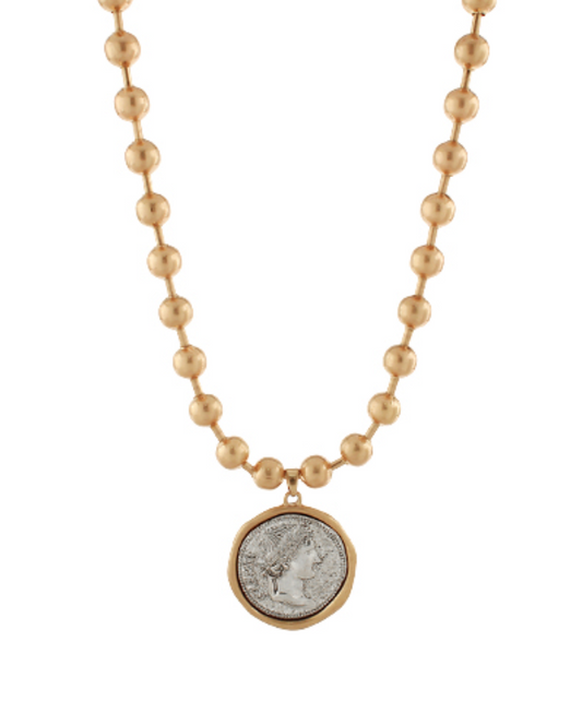 Elegant beaded chain necklace with a vintage-inspired coin pendant, exuding classic sophistication.