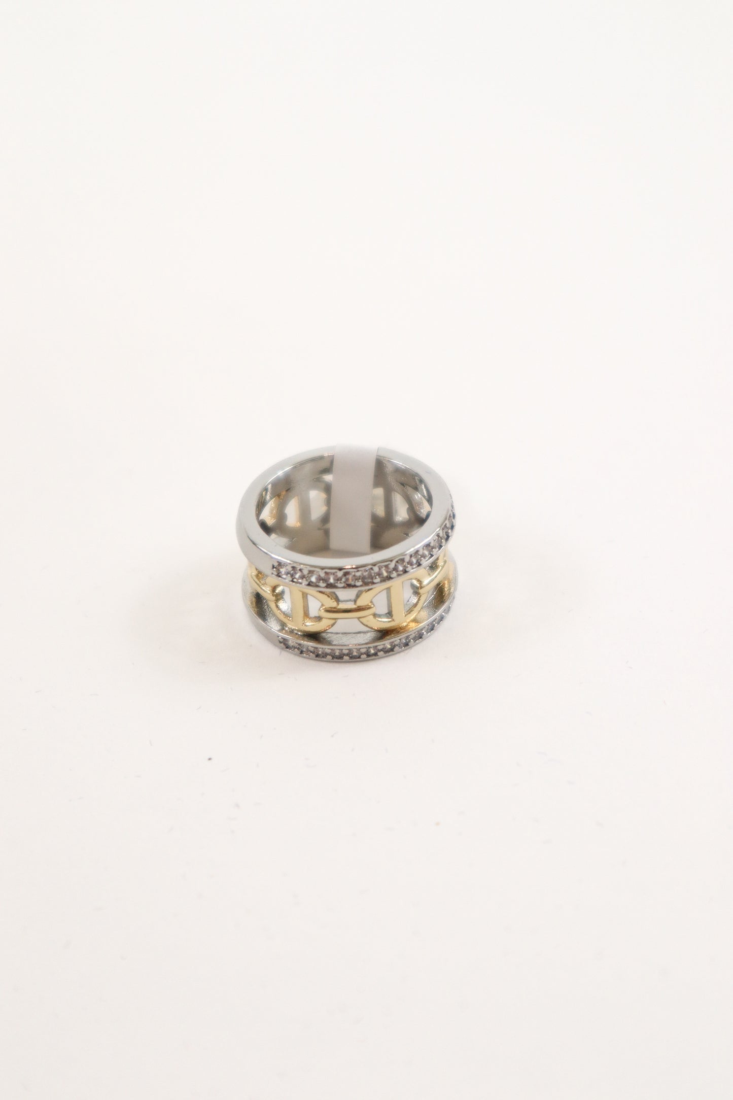 Mixed metal wide band ring with gold link center and crystal trim accents