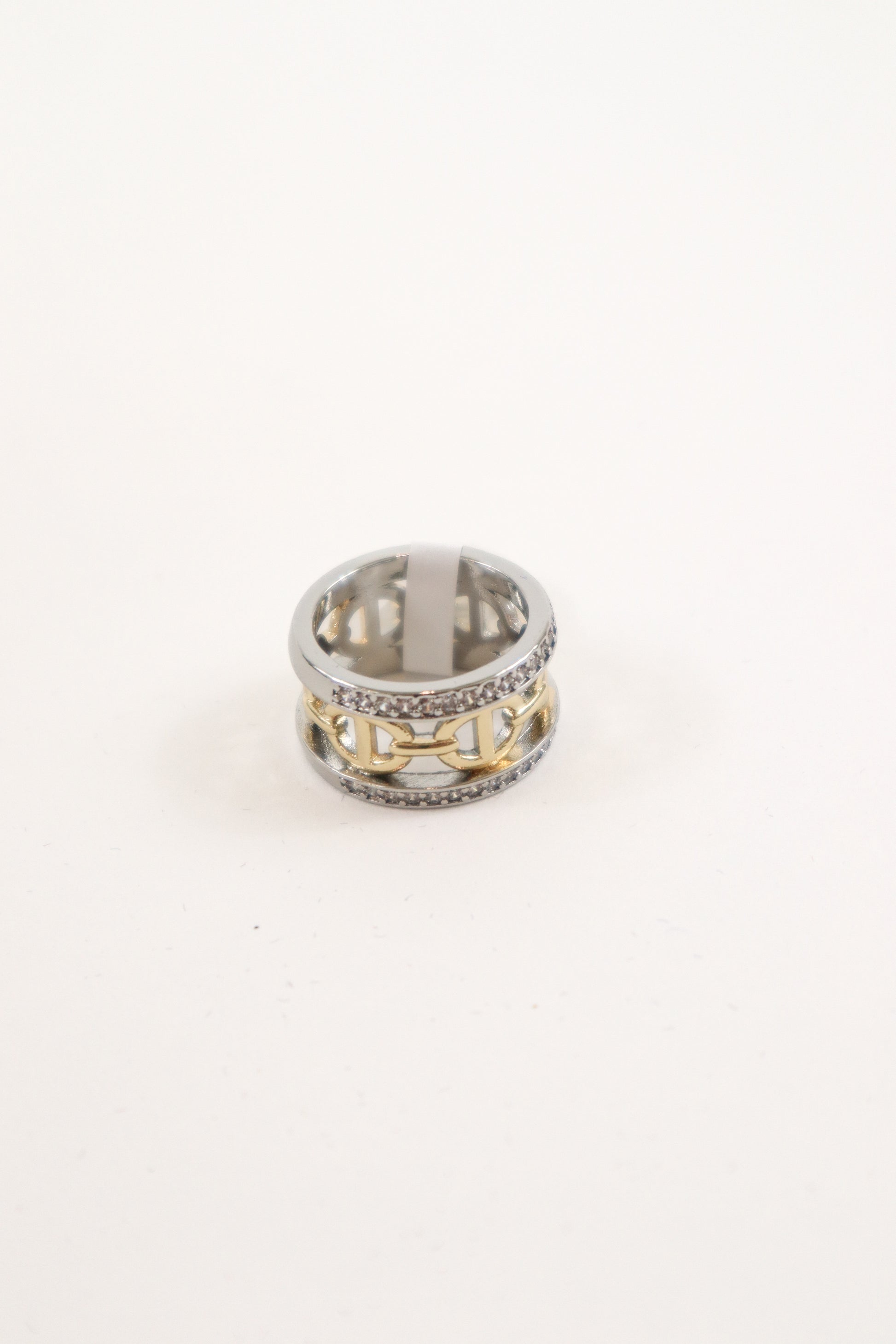 Mixed metal wide band ring with gold link center and crystal trim accents