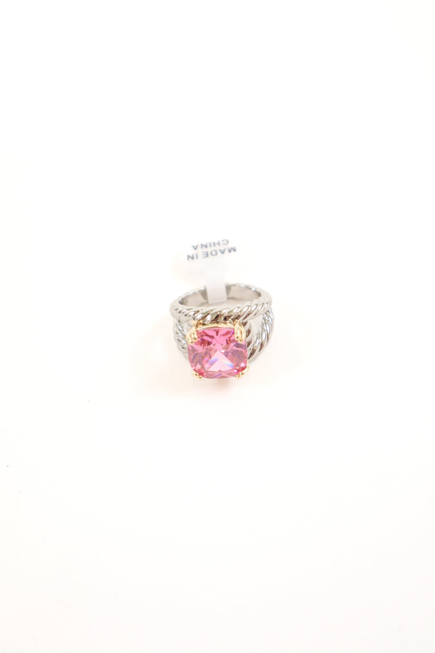 Cushion-cut statement ring with gold prongs and textured silver band