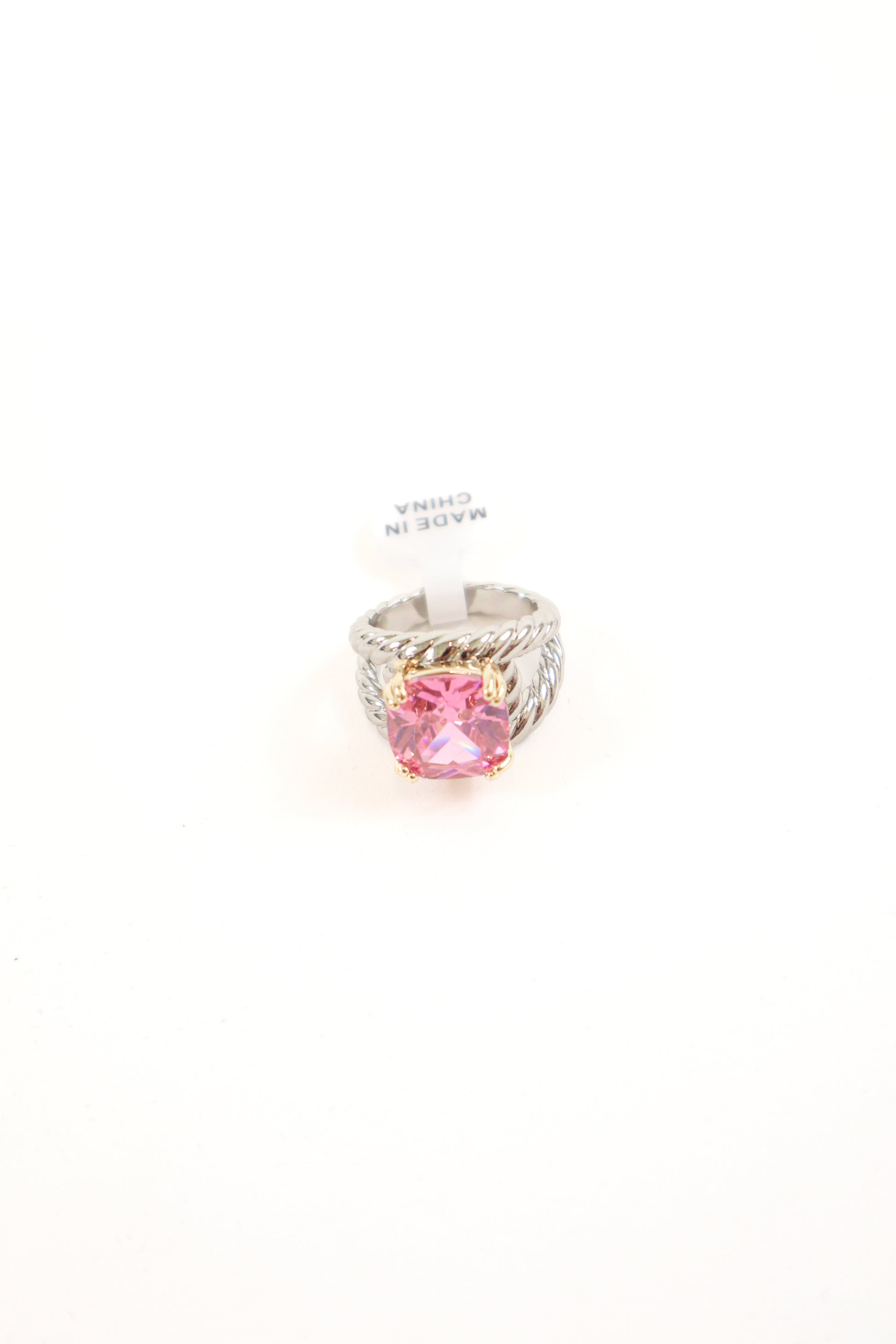 Cushion-cut statement ring with gold prongs and textured silver band