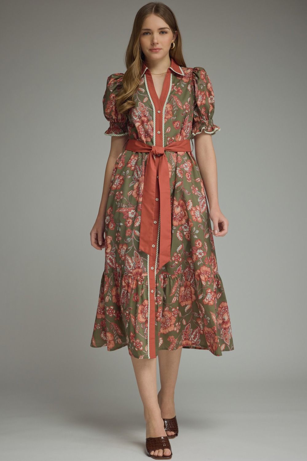 A timeless floral midi dress featuring feminine puff sleeves, a flattering self-tie waist, and elegant contrast trim for effortless everyday style.